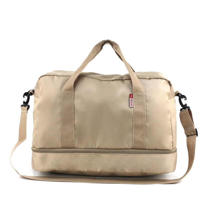 Travel bag with shoe compartment